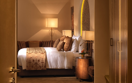 Deluxe room bed Marsa Malaz Kempinski